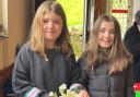 Two young volunteers at the Easter Sunday service fundraiser in Llanfair Caereinion.