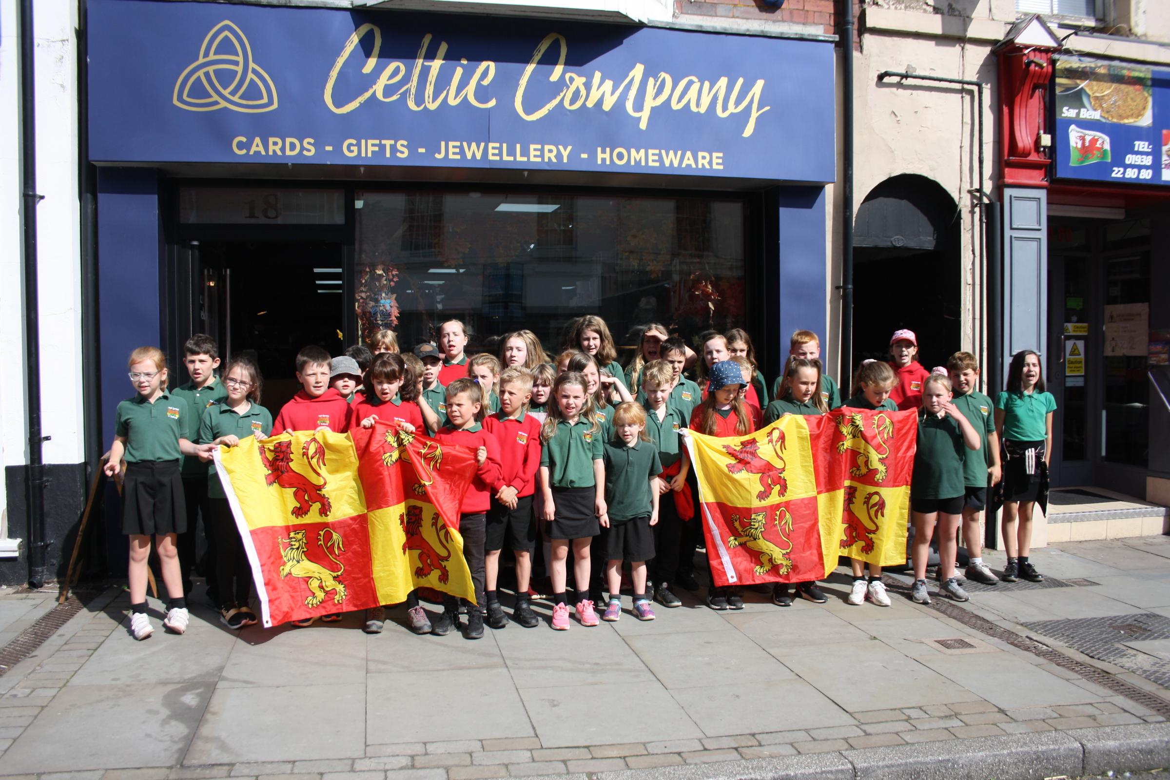 Ysgol Gymraeg Y Trallwng sing in Welshpool town centre to celebrate Owain Glyndwr Day on September 16, 2021. Picture by Anwen Parry/County Times