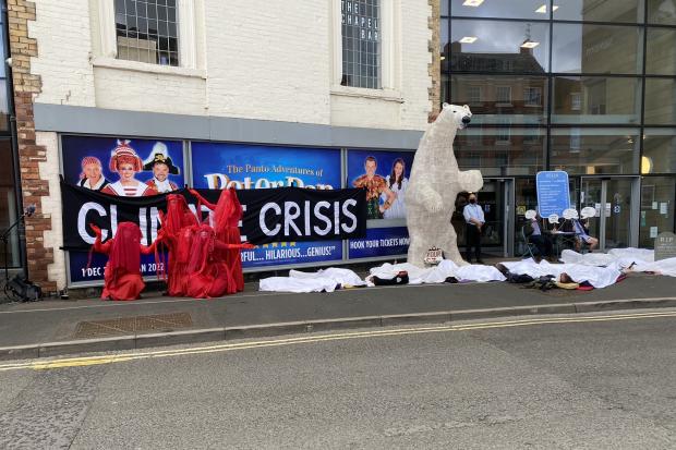 Protesters - including a 10ft polar bear - gathered outside Theatre Severn this morning.