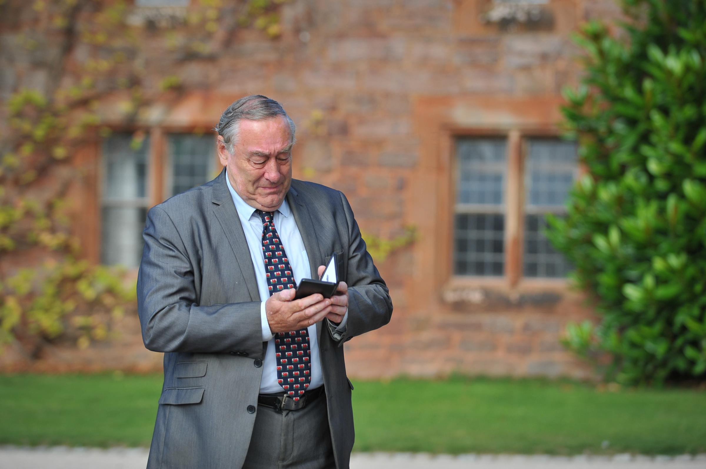 WELSHPOOL, WALES - Robert Robinson receives his MBE award at a presentation ceremony at Powis Castle (Mike Sheridan/County Times).