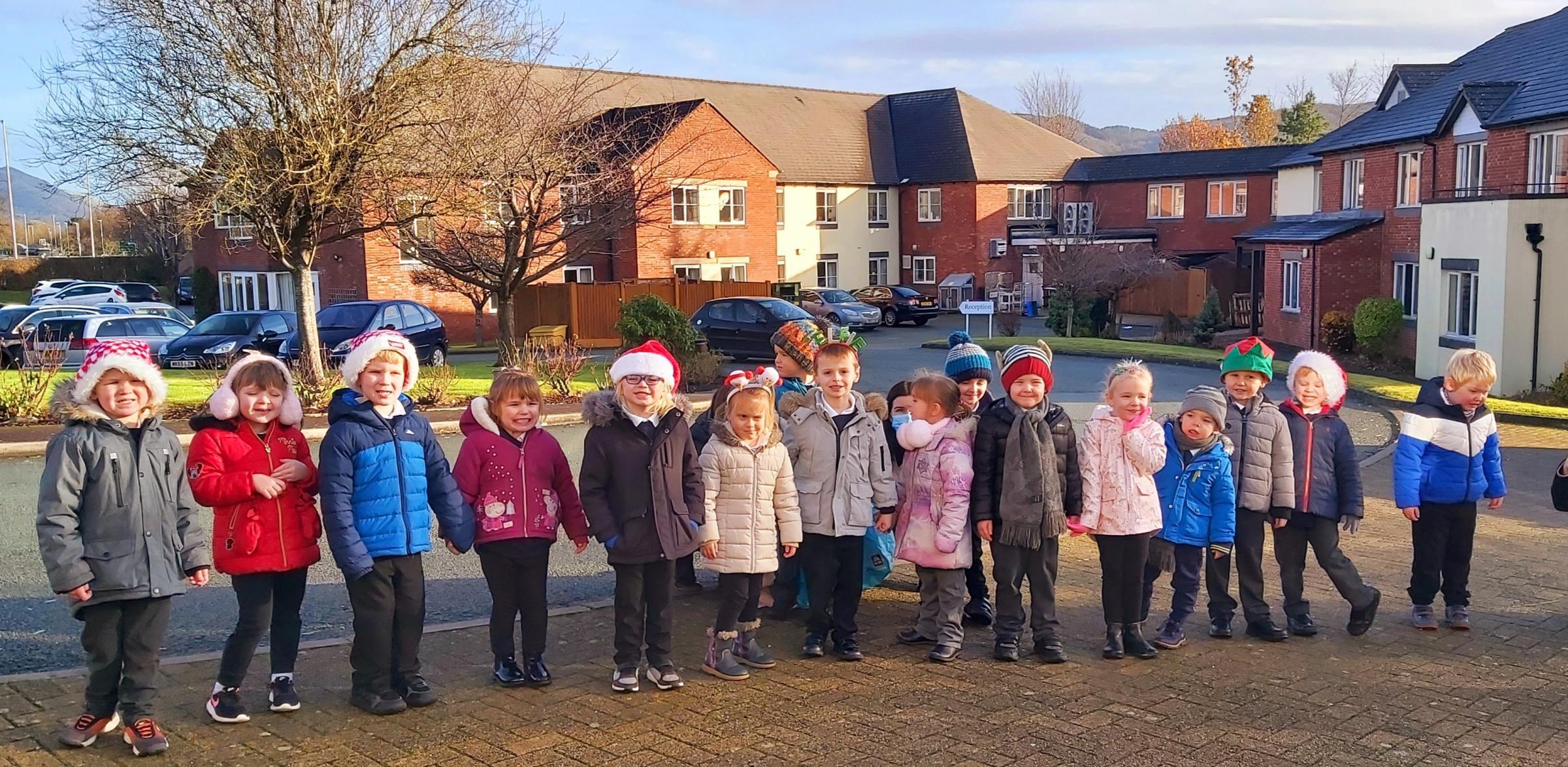 Welshpool Church in Wales Primary School sang Christmas carols to residents at The Rhallt care home.