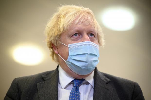 County Times: Boris Johnson wearing a mask. Credit: PA