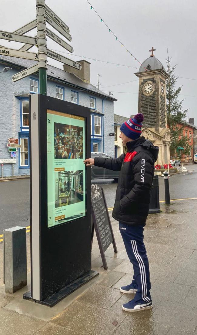 A local uses the new interactive digital totem