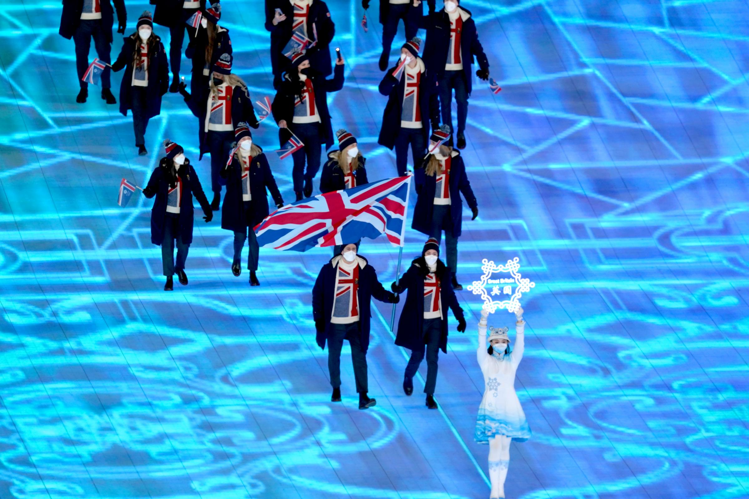 Great Britains flag bearers Dave Ryding and Eve Muirhead lead the team out during the opening ceremony of the Beijing 2022 Winter Olympic Games at the Beijing National Stadium in China. Picture date: Friday February 4, 2022.