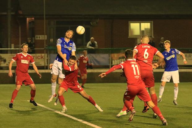 Action from Newtown's defeat against Penybont. Picture by Dave Evans.