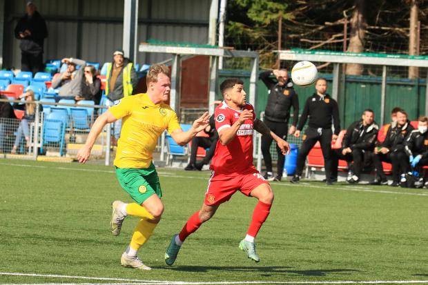 Action from Newtown's win over Caernarfon Town. Picture by Dave Evans.