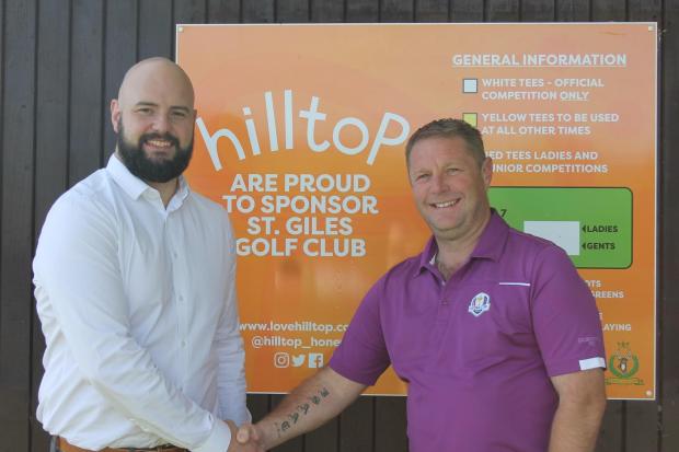 St Giles Golf Club captain Jason Jones (right) congratulates Scott Davies of Hilltop on becoming the club’s main sponsor.