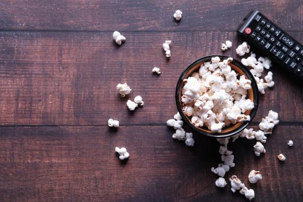 County Times: A bowl of popcorn and a TV remote (Canva)