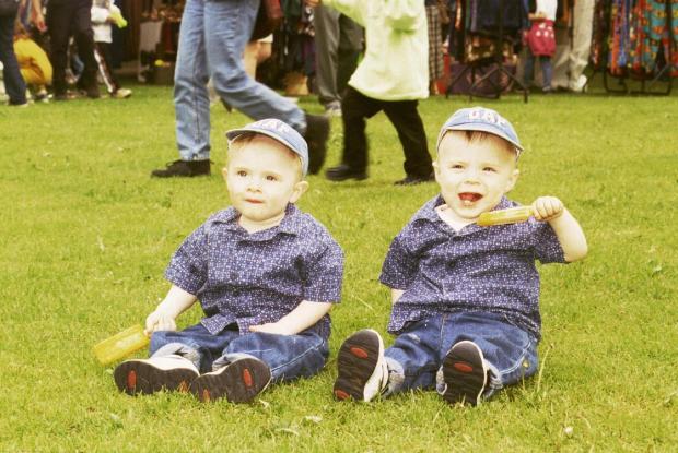 County Times: Newtown May Festival, Callum and Huw Evans , 18 month year old twins, from Caersws ,taking a well earned break from the festivities.
