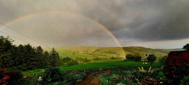County Times: Rainbow over Carno.  Photo by André Hutchinson.