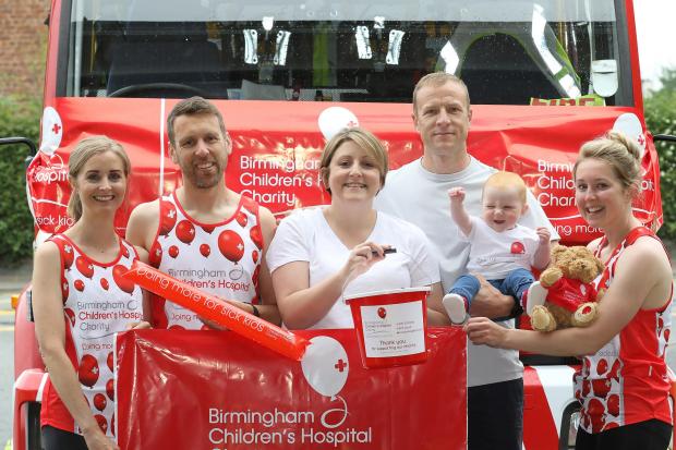 Baby Eleri Godsell punches the air to launch the fundraising with (from left) Melissa and Phil Turnbull, Katy and Neil Godsell and Ffion Evans. Picture by Phil Blagg Photography. PB059-2022.