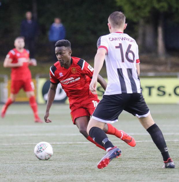 County Times: Lifumpa Mwandwe in action for Newtown during his 2019 loan spell. Picture: Phil Blagg
