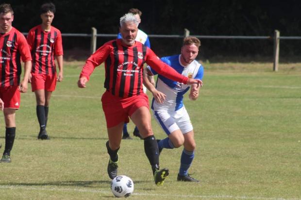 County Times: Action from Machynlleth's win over Talgarth Town. Picture by Barcud-Coch Photography.