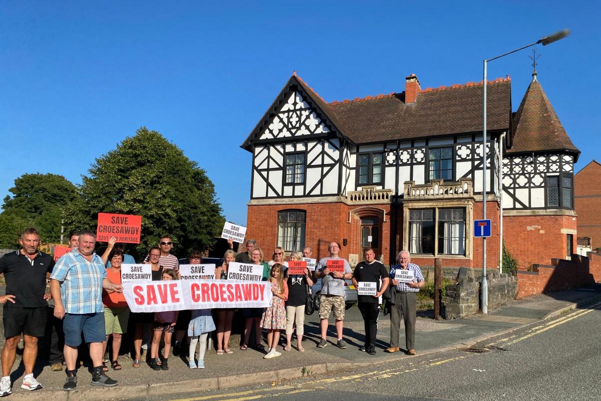Residents and people concerned with a proposal to demolish Croesawdy in New Road gathered with their campaign banners and plaquards on Tuesday, August 9, 2022. Picture by Anwen Parry/County Times