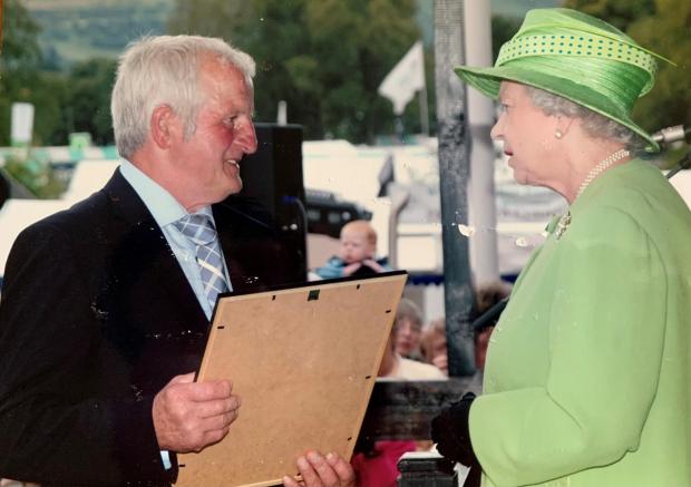 County Times: The Queen then presents Estate Supervisor Dennis Jones with an award marking 20 years of service to RWAS