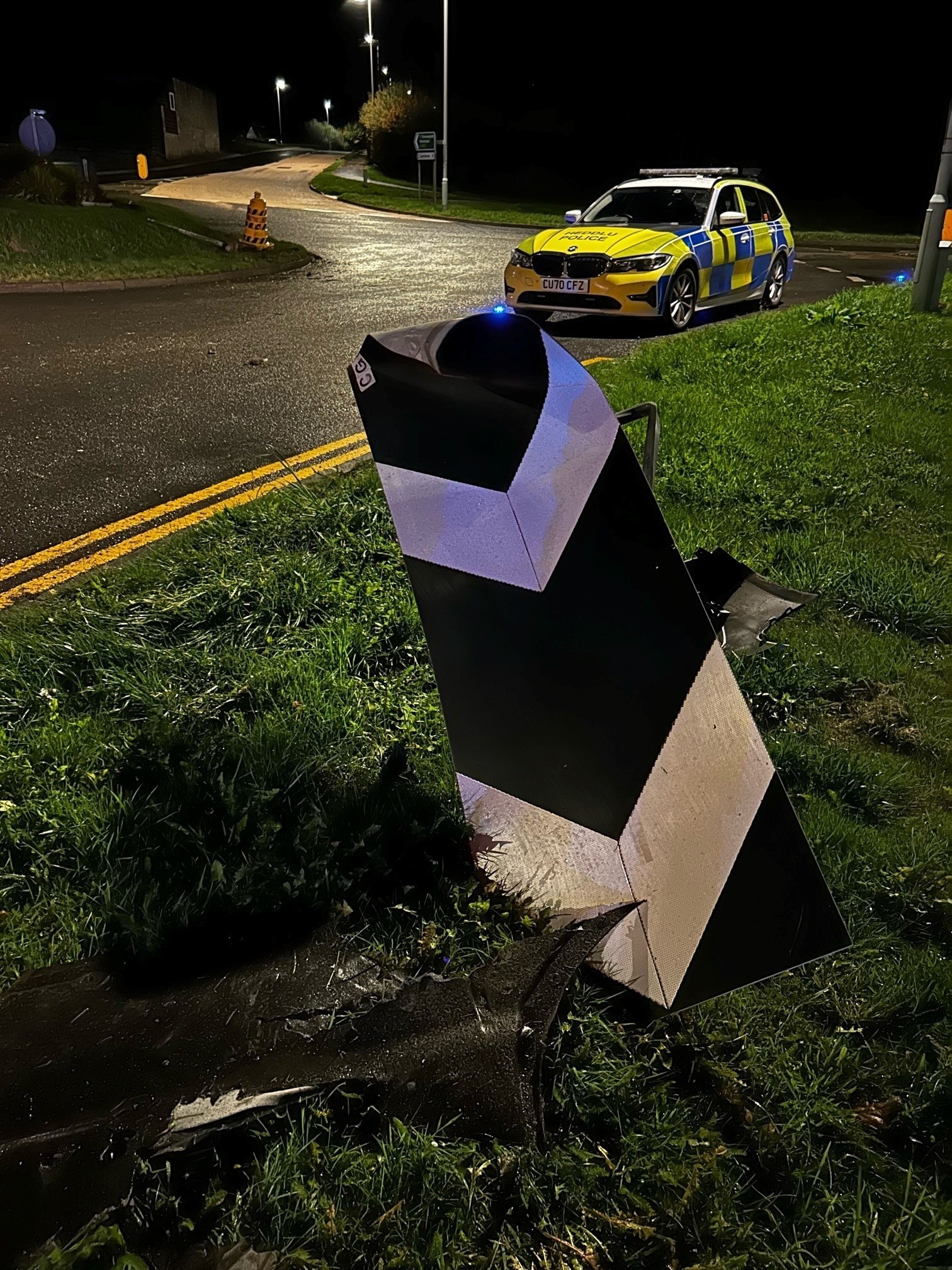 A broken roundabout sign in Crossgates after an Audi crashed during a high-speed police stop. Picture by Powys Roads Policing Dyfed-Powys Powys