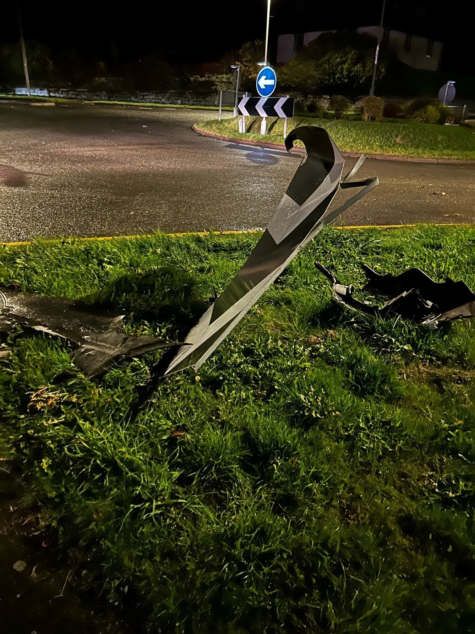 Parts of the Audi were found strewn near the Crossgates roundabout after the car collided with a sign with three deflating tyres before crashing into a hedge. Picture by Powys Roads Policing/Dyfed-Powys Police