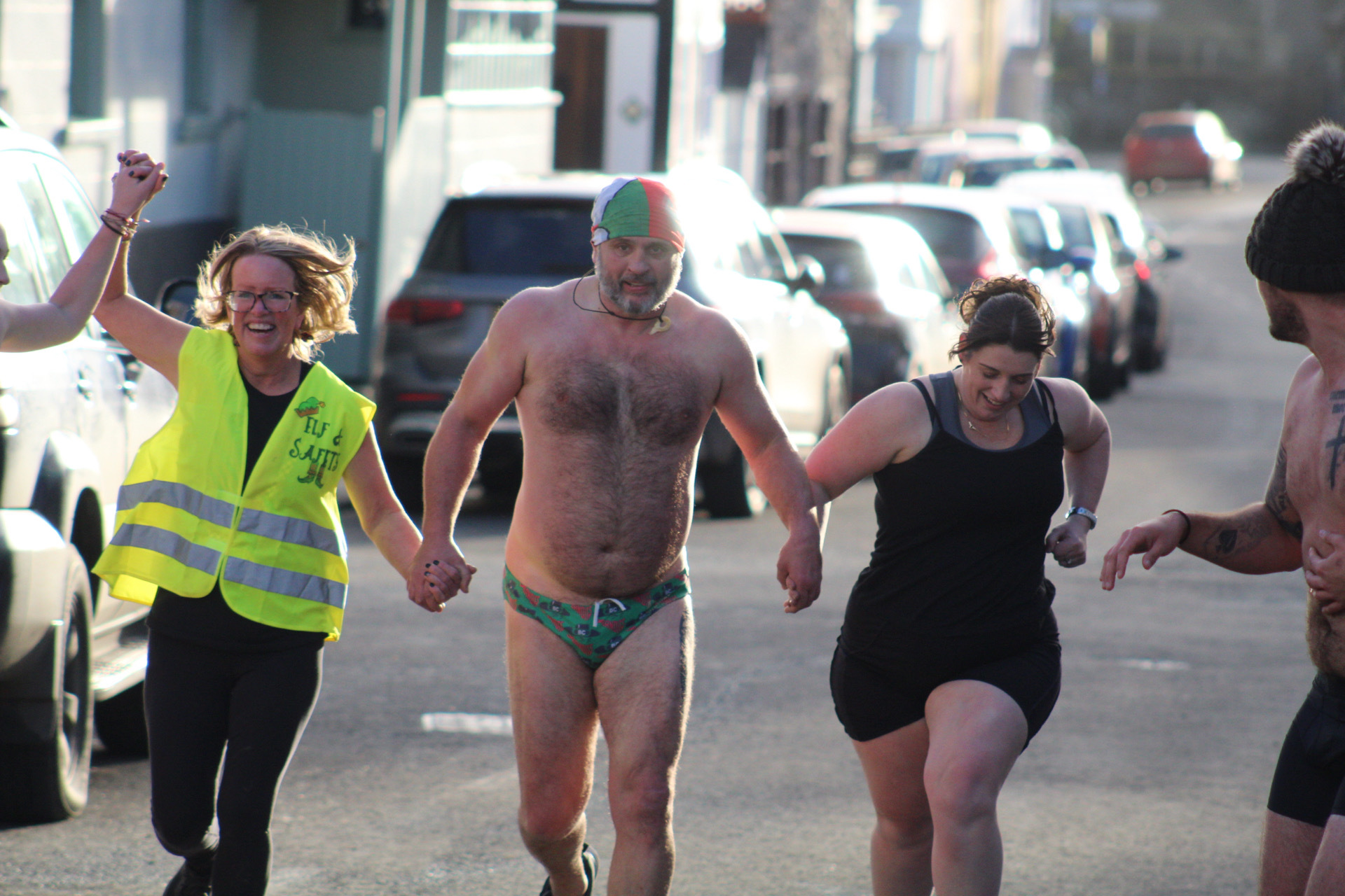 Rachel Gee, Dylans father Darren Price and Emma Hockley cross the line at the second annual Boxing Day underwear run in aid of The Dylan Price Foundation. Picture by Jack Butler-Jones