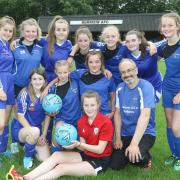 Berriew Football Club's girls under 14's side with Paul Inns and Manchester United star Carrie Jones in 2019.