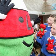Newtown's St Mary's Catholic Primary School pupils with the legendary Mr Urdd.