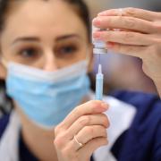 File photo dated 16/12/21 of medical staff preparing shots of the Moderna Covid-19 vaccine, as American pharmaceutical giant Moderna will open a new research and manufacturing centre in the UK..