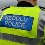 Dyfed Powys Police say a man's body was found in a field near Penybont on Monday