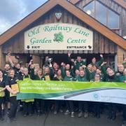 Staff at the Old Railway Line Garden Centre celebrate being named the best in the UK