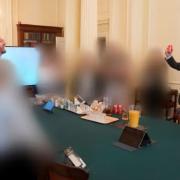 An image from the Sue Gray report showing the Prime Minister apparently raising a can of beer on his birthday (Sue Gray Report/Cabinet Office/PA)