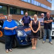 Driving instructors raise concerns about lack of examiners in Newtown - l-r Tracey Evans, John Tomley, Lauren Owen, Keith Blanchard and Paddy O'Kennedy. Picture by Anwen Parry/County Times [Monday, July 18, 2022]