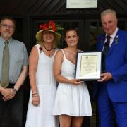 Mollie receives her award from show president Harry Fetherstonhaugh