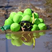 A competitor takes part in the World Bog Snorkelling Championships at Waen Rhydd peat bog in Llanwrtyd Wells, Wales. PRESS ASSOCIATION Photo. Picture date: Sunday August 25, 2019. Photo credit should read: Jacob King/PA Wire.