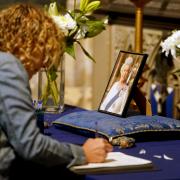 Mourners sign the book condolence at Canterbury Cathedral in Kent following the death of Queen Elizabeth II on Thursday. Picture date: Friday September 9, 2022.