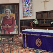 'The Enduring Monarch' by dan Llewelyn Hall, on display at St Myllin's Church alongside the Book of Condolence.