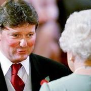 William Lloyd Williams, a butcher from Machynlleth, receives an MBE from Queen Elizabeth II for services to the meat industry with a Biro tucked behind his ear in 2009. Picture by PA Images.