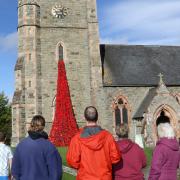 The poppy waterfall took over 60 hours to assemble and erect at the church. Picture by phil Blagg Photography.
