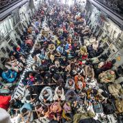 A full flight of 265 people supported by members of the UK Armed Forces on board an evacuation flight out of Kabul airport, Afghanistan.