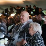 Atom bomb test veteran Brian Davies, 84, and his wife Hazel from Llanfair Caereinion, Powys, react during a commemoration event at the National Memorial Arboretum in Alrewas, Staffordshire, where Prime Minister Rishi Sunak announced that Nuclear test