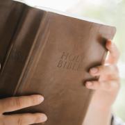 A person reads a Bible.