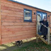 Salop Leisure Innovative Solutions’ project manager Samantha Stubbs with one of the shepherd's huts