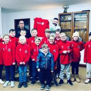 Knighton Town under nine’s have received new training tops courtesy of sponsorship from Nicky Tranter Tree Care.