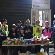 Builth and District Running Club members pictured with local Helping our Homeless Wales co-ordinator Sarah Mason