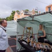 Newtown Mayor John Byrne speaks to a stall holder at the Young Traders Day at the Tuesday Charter Market in August 2022