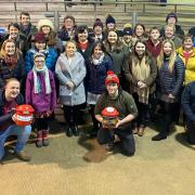 A group of current and past members of Brecknock YFC at the county carol service in Brecon Market last December