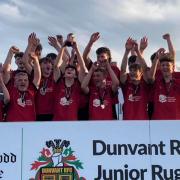 Newtown players celebrate in Dunvant.