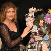 Newtown art and design college student Tianna Beau Green with her Laura Ashley paper dress.