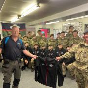 Newtown Army Cadet Force receiving their new windproof jackets from Powys Gas.