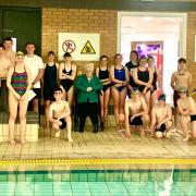Bronwen Poole and some of the young members of Welshpool Sharks Swimming Club.