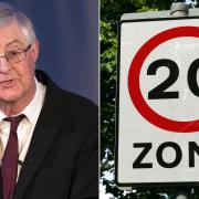 First Minister Mark Drakeford and a 20mph sign.