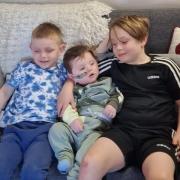 Alfie pictured with brothers Tommy and Freddie