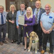 Pictured (l-r) are past Builth Rotary president Baden Powell, Guide Dogs Cymru representative Ruth Evans, Rotary president Ciaran O’Connell, Heather Gethin, Rotarians Richard Davies and Nigel Gethin and, of course, newest member Farley.
